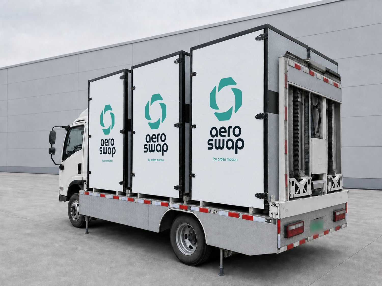 Aeroswap S6 truck from the rear, showing three white modules and the onboard exchange mechanism