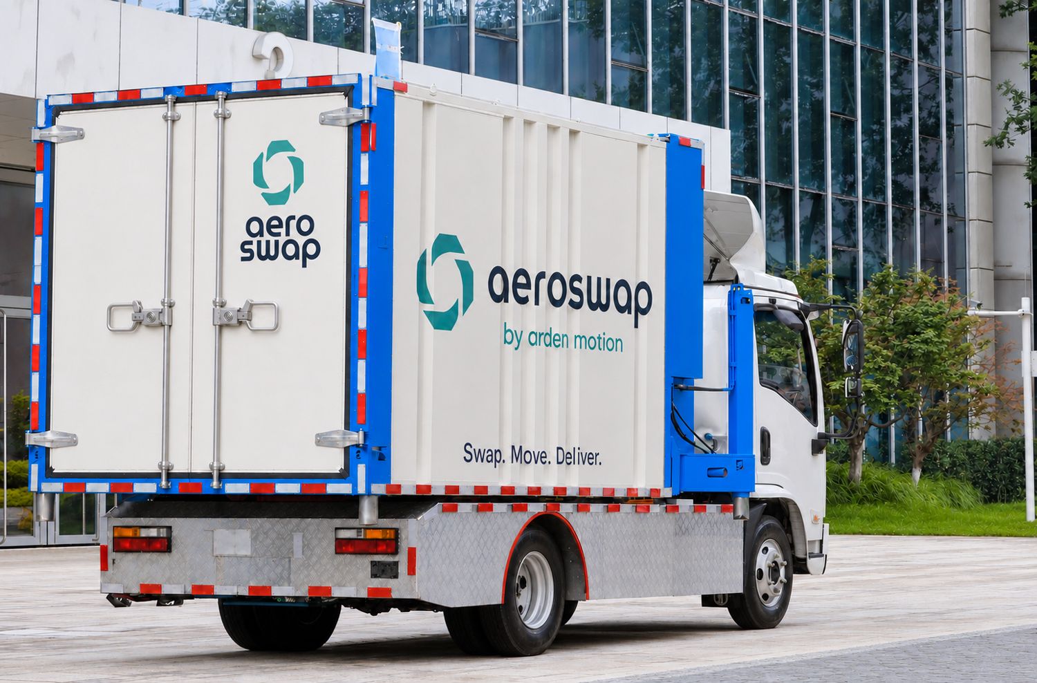 Aeroswap S1 with a large white and blue module, parked outside an office building